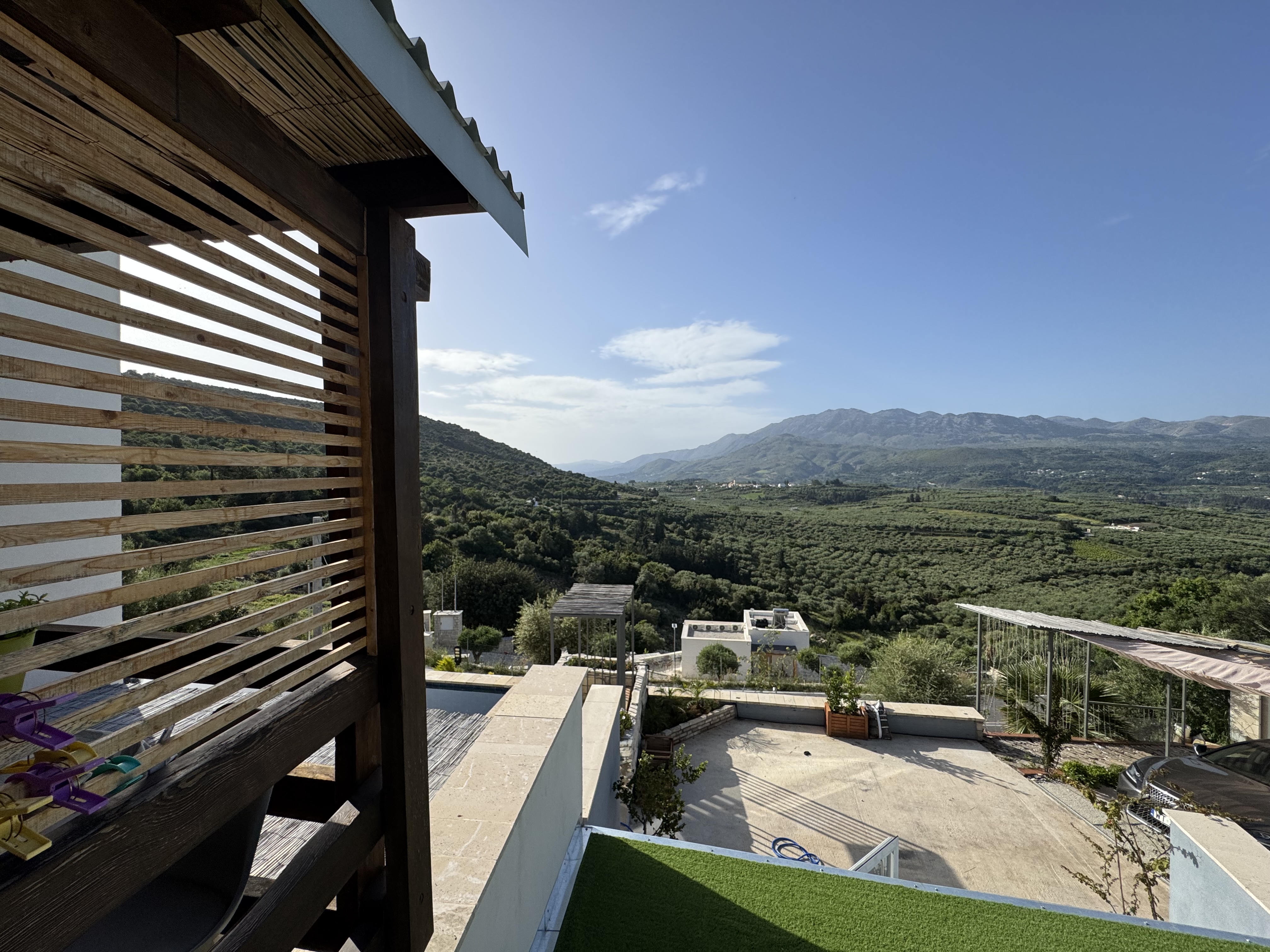 Panoramic view of Cretan mountains and valleys from property terrace